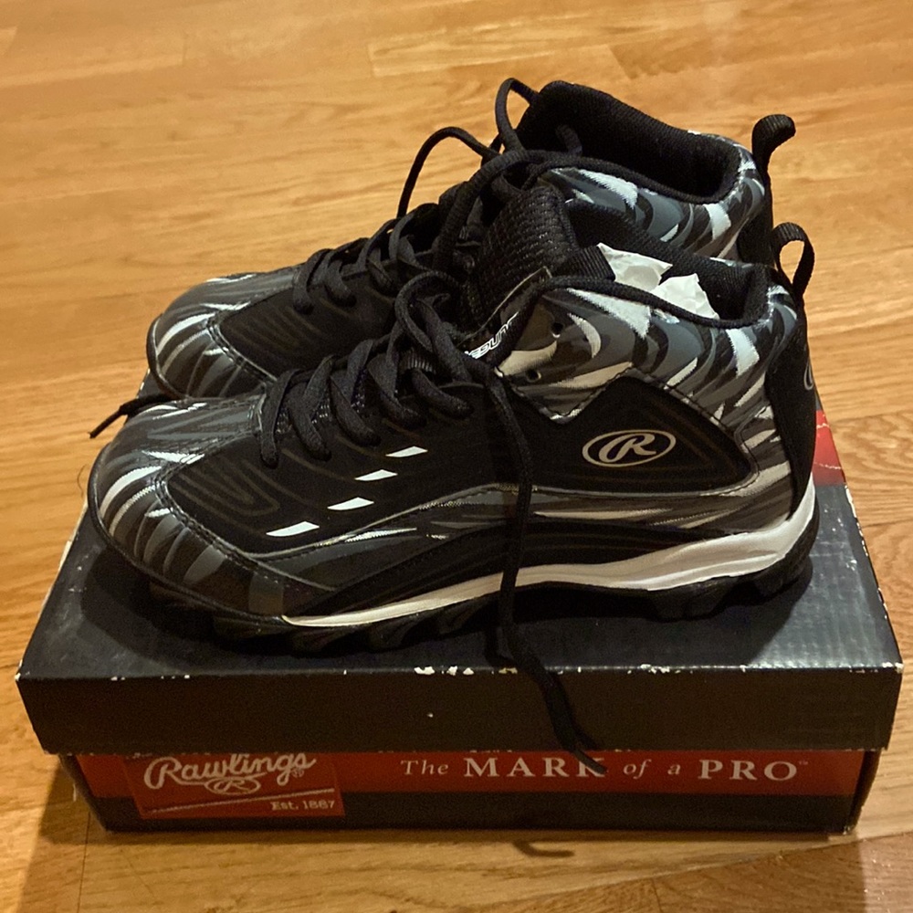 New Boys Rawlings football cleats.  Never used.